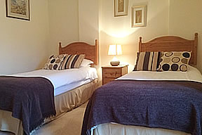 Bedroom 4 - twin beds with ensuite bath/shower, WC and basin