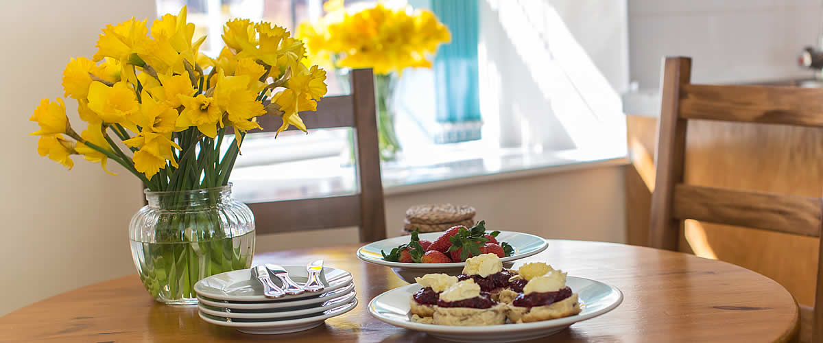 A delicious cream tea awaits guests on arrival